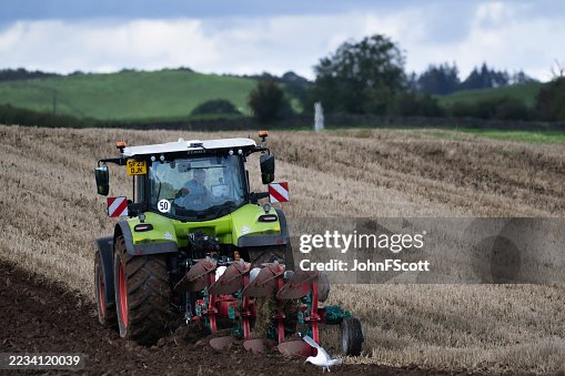 Ploughing a field after a harvest Ploughing a field after a harvest