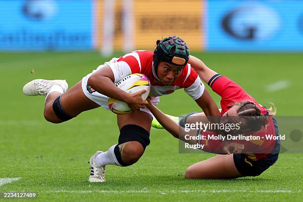 Jennifer Nduka of Japan is tackled Lea Ducher of Spain during the Women's Rugby World Cup 2025 Pool C match between Japan and Spain at the York...