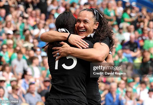 Portia Woodman-Wickliffe of New Zealand celebrates with team mate Stacey Waaka after scoring her team's first try during the Women's Rugby World Cup...