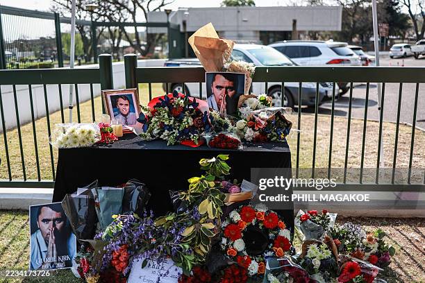 General view of a wreath laid by mourners outside the US Embassy in Pretoria on September 11, 2025 following the fatal shooting of US youth activist...