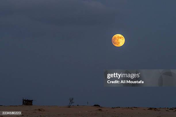 The “Blood Moon” rises in the sky during a total lunar eclipse, in the Sinai desert near Al-Arish on September 7, 2025 in Arish, Egypt. A lunar...