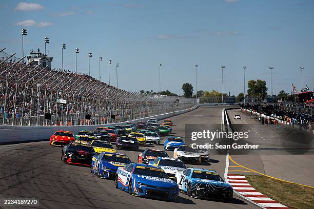 Kyle Larson, driver of the HendrickCars.com Chevrolet, and William Byron, driver of the Z by HP Chevrolet, lead the field during the NASCAR Cup...