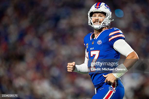 Josh Allen of the Buffalo Bills celebrates after a touchdown during an NFL football game against the Baltimore Ravens at Highmark Stadium on...