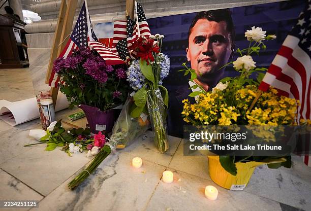 Flowers, U.S. Flags and candles comprise a makeshift memorial at the Utah state Capitol following the shooting death of political activist Charlie...