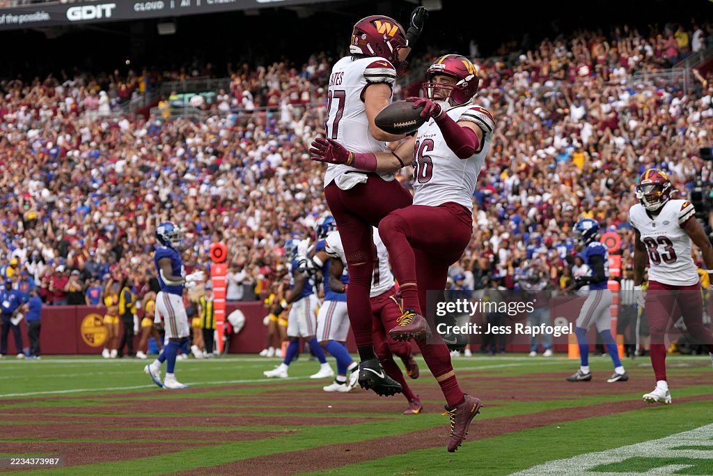 Zach Ertz of the Washington Commanders celebrates his touchdown