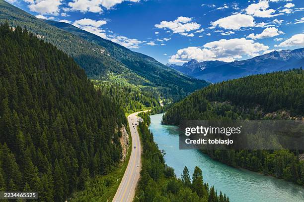 road trip along mountain river in canadian rockies - canadian rockies stock pictures, royalty-free photos & images
