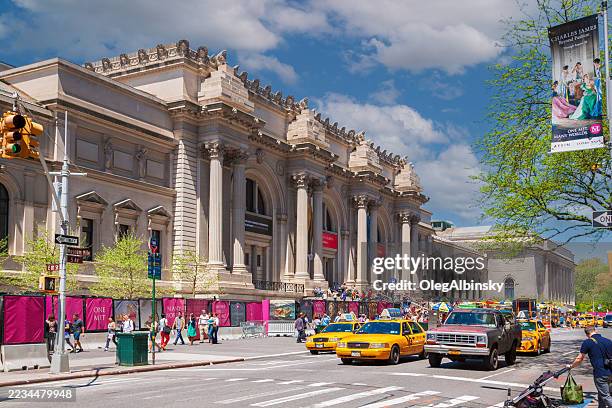 the metropolitan museum of art, 5th avenue at uptown manhattan and blue sky with puffy clouds, new york, usa. - metropolitan museum of art new york city stock pictures, royalty-free photos & images