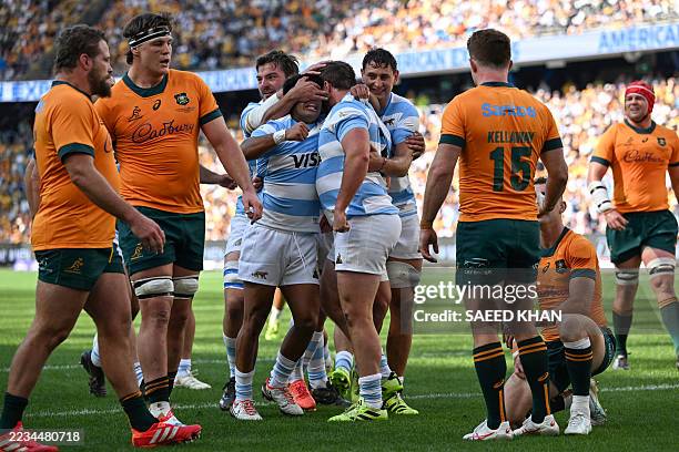 Argentina players celebrate a try by teammate Julian Montoya during their Rugby Championship match against Australia at Allianz Stadium in Sydney on...