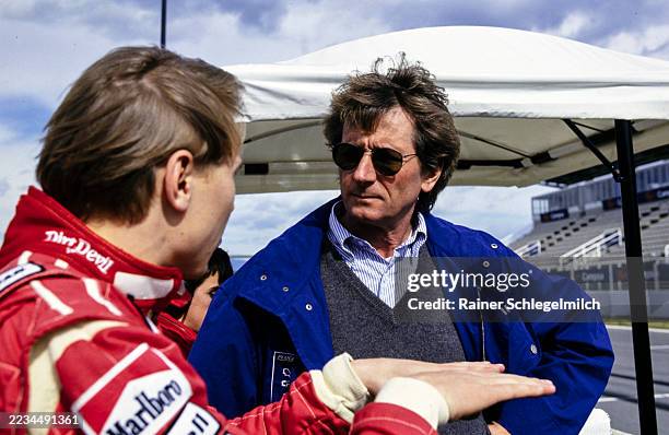 Mika Häkkinen chats with Peugeot Sport director Jean-Pierre Jabouille in the pit lane during F1 Testing at Circuit de Barcelona-Catalunya, Montmeló,...