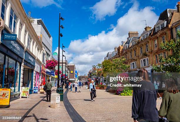shoppers in bromley high street - high street stock-fotos und bilder