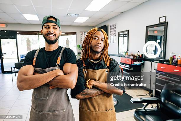 portrait of two barbers in the shop - modern manhood stock pictures, royalty-free photos & images