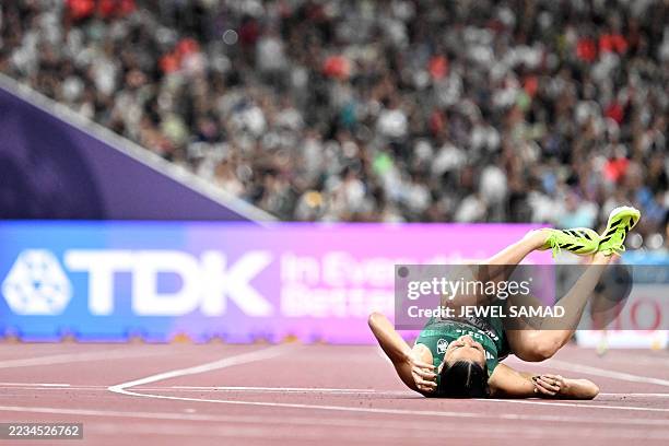 Ireland's athlete Sophie O'Sullivan falls as she competes in the women's 1500m heats during the World Athletics Championships in Tokyo on September...