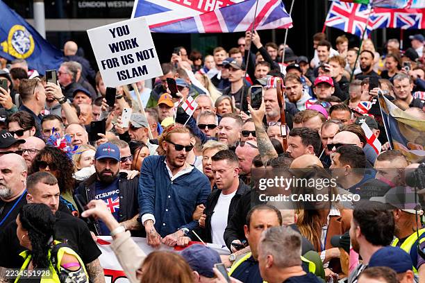 British far-right activist Tommy Robinson , whose real name is Stephen Yaxley-Lennon, marches with supporters including actor and right-wing activist...