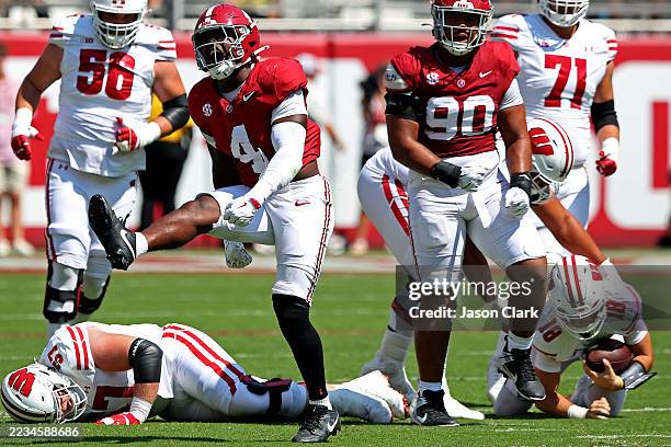 Qua Russaw of the Alabama Crimson Tide celebrates after recording a sack during the first half of the game against the Wisconsin Badgers at...