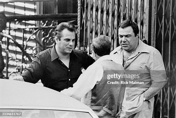 John Gotti speaks to an underling while Angelo Ruggiero listens. The bugging of Ruggiero's home gave the FBI its initial opening against the Gambino...