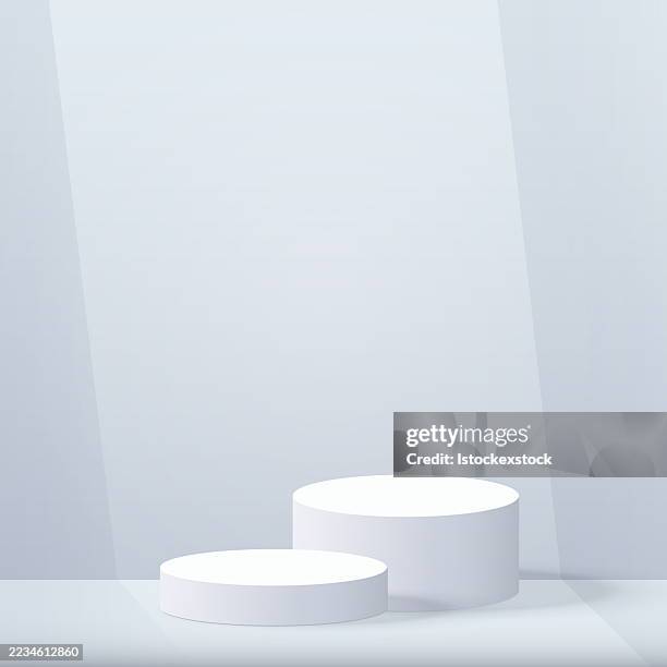 two white circular podiums on a light gray background - luxury window display stock illustrations