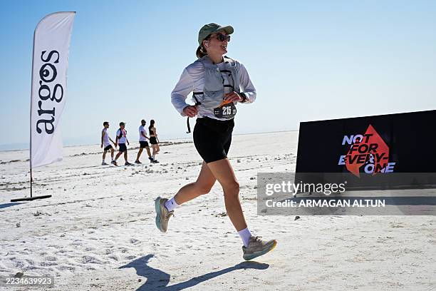 Runner competes on the salt flats during the Runfire Salt Lake '25 Ultramarathon in Salt Lake, Eskil - Aksaray, Turkey on August 23, 2025. The...