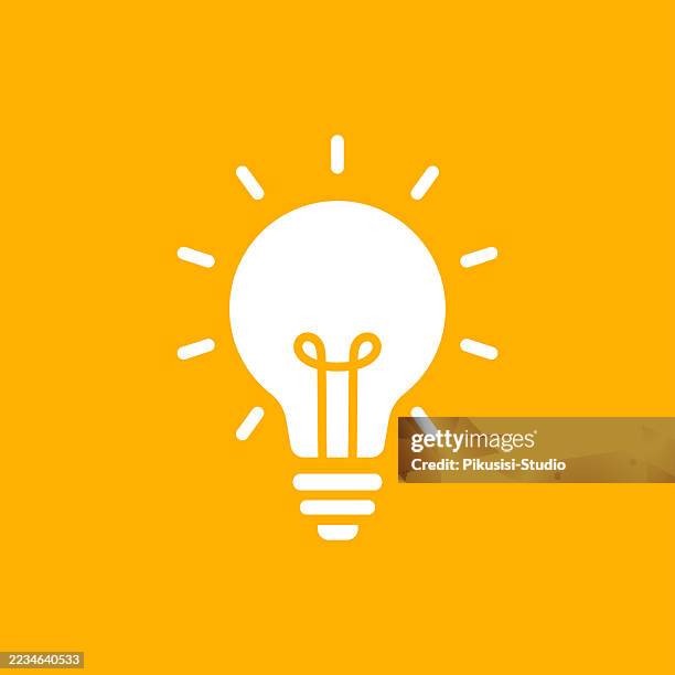 white light bulb icon on yellow background - light bulb stock illustrations