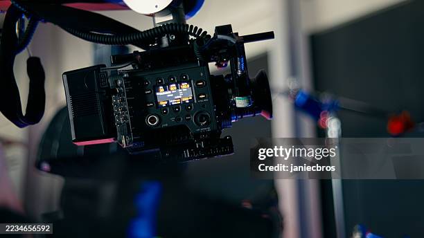 shooting day in a photography studio. camera equipment displaying data parameters. modern commercial film and photography studio - setting up camera stock pictures, royalty-free photos & images