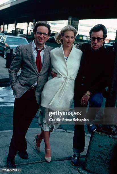 Portrait of, from left, American actor John Ritter , Canadian model & actor Dorothy Stratten , and film director Peter Bogdanovich during the filming...