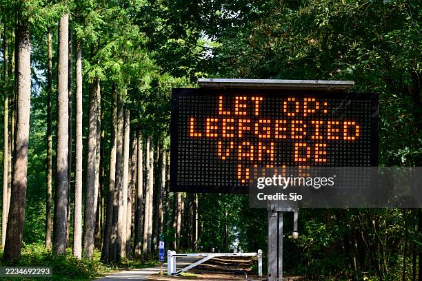 wolf warning sign in epe at the veluwe nature reserve - wildlife reserve stock pictures, royalty-free photos & images