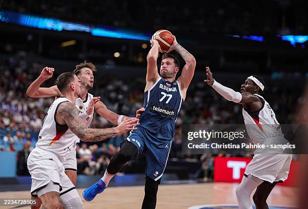 Luka Doncic of Slovenia, Daniel Theis of Germany, Franz Wagner of Germany, Isaac Bonga of Germany during the FIBA EuroBasket 2025 quarterfinal...