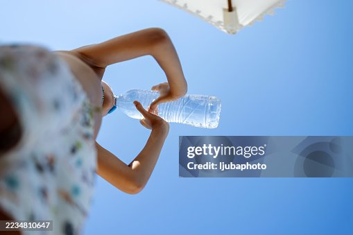 Relaxing Under Sunny Skies While Staying Hydrated on a Summer Day Relaxing Under Sunny Skies While Staying Hydrated on a Summer Day