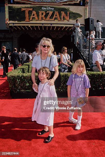 American actress Teri Garr, wearing sunglasses, and her daughter, Molly, who wears a white dress, attend the Hollywood premiere of 'Tarzan' at the El...