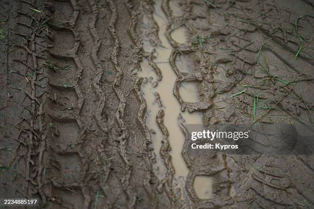 tire tracks or tire imprint in mud on off road dirt track - tractor tyre stock pictures, royalty-free photos & images