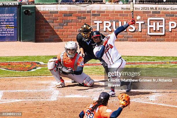 Ozzie Albies of the Atlanta Braves hits an RBI single in the fifth inning during the game against the Houston Astros at Truist Park on September 14,...