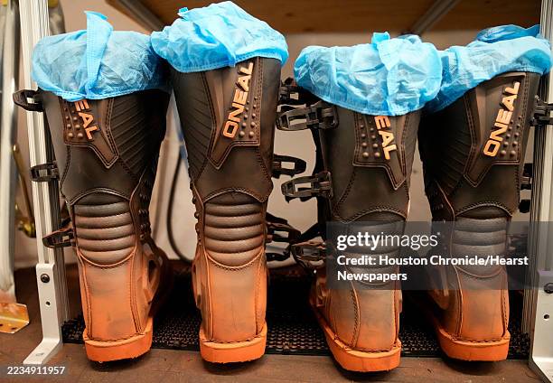 Boots coated from the Mars sand box are shown in a containment area at the Crew Health and Performance Exploration Analog Mars at the NASA Johnson...