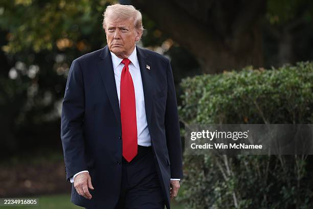 President Donald walks toward reporters while departing the White House on September 11, 2025 in Washington, DC. Trump is scheduled to travel to New...