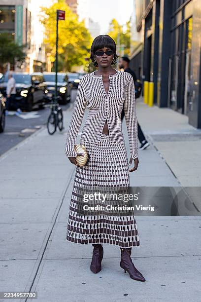 Guest wears striped skirt, top outside Simkhai during New York Fashion Week on September 11, 2025 in New York City.