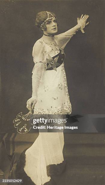 French prisoner of war acting in an internment camp in Dülmen, performing in drag, wearing a long white dress, . Creator: Unknown.
