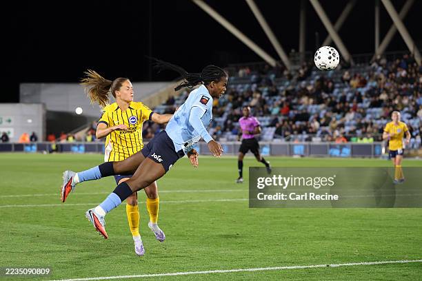 Khadija Shaw of Manchester City scores his team's first goal with a diving header during the Barclays Women's Super League match between Manchester...