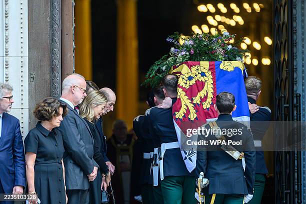 George Windsor, Earl of St Andrews, Prince Edward Duke of Kent and his daughter Lady Helen Taylor look on the as the bearer party carry the coffin in...