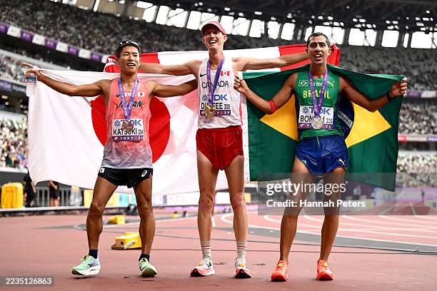 Bronze medalist Hayato Katsuki of Team Japan, Gold medalist Evan Dunfee of Team Canada, and Silver medalist Caio Bonfim of Team Brazil pose for a...
