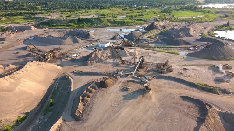 https://media.gettyimages.com/id/2235127960/video/haul-truck-carrying-a-load-of-aggregate-at-a-gravel-pit-in-caledon-canada-aerial-flyover-at.jpg?b=1&s=640x640&k=20&c=ls1mgUcT31L1PYrR_5m0zosv1SQxkJ9Ml6kosTP8HAk=