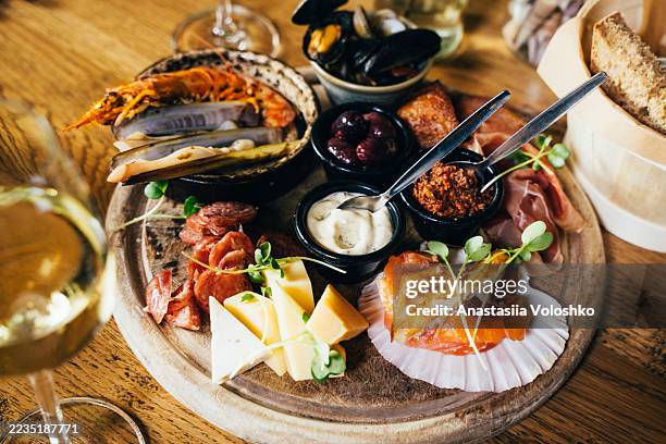 charcuterie and seafood platter with wine - spanish culture stock pictures, royalty-free photos & images