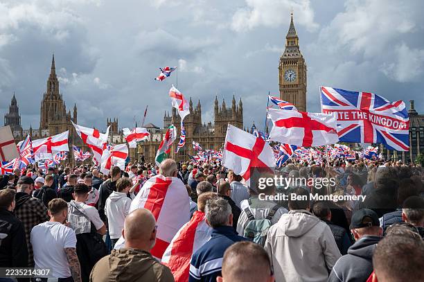 Members of the public cross Westminster Bridge bound for Whitehall during the Unite The Kingdom rally in Central London on September 13, 2025 in...