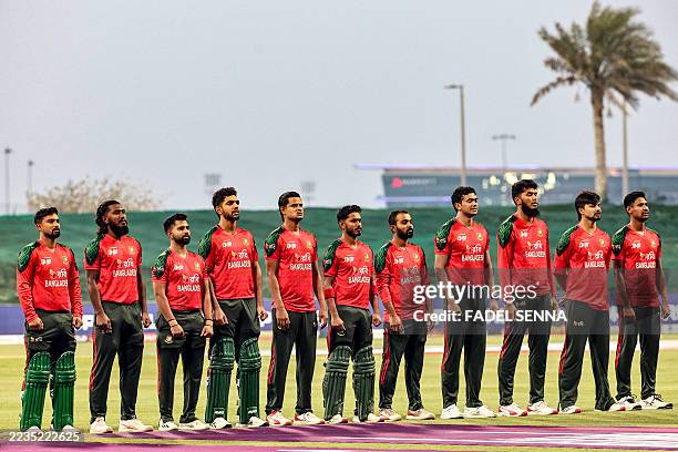 Bangladesh's team players stand for their national anthem before the start of the Asia Cup 2025 Twenty20 international cricket match between...