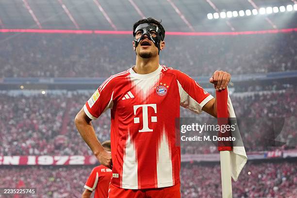 Aleksandar Pavlovic of Bayern Munich celebrates scoring his team's second goal during the Bundesliga match between FC Bayern München and Hamburger SV...