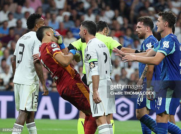 Real Madrid's Spanish defender Dani Carvajal faces Marseille's Argentine goalkeeper Geronimo Rulli during the UEFA Champions League first round day 1...