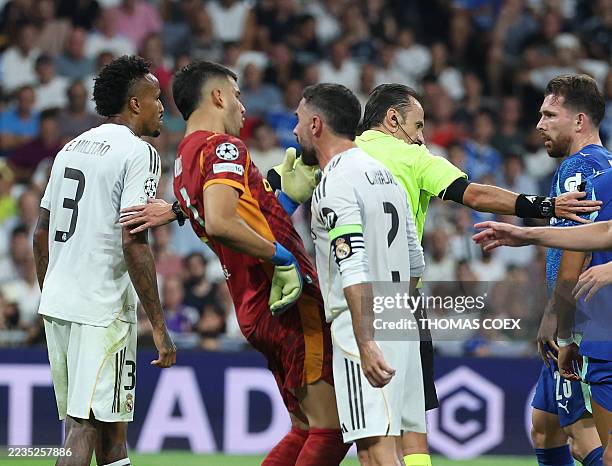 Real Madrid's Spanish defender Dani Carvajal faces Marseille's Argentine goalkeeper Geronimo Rulli during the UEFA Champions League first round day 1...