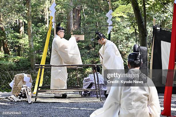 Priests attend a tree-felling ceremony at Ise Jingu shrine in Ise, Mie Prefecture, on Sept. 17 as part of rites for the "Shikinen Sengu" shrine...