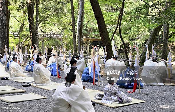Priests attend a tree-felling ceremony at Ise Jingu shrine in Ise, Mie Prefecture, on Sept. 17 as part of rites for the "Shikinen Sengu" shrine...