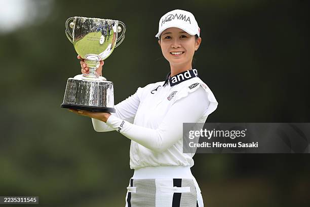 Shina Kanazawa of Japan poses with the trophy following victory in the final round of SONY JLPGA CHAMPIONSHIP at Oarai Golf Club on September 14,...