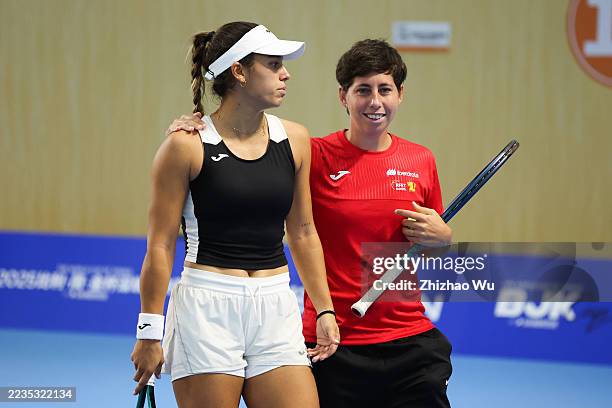 Jessica Bouzas Maneiro of Spain interacts with Carla Suarez Navarro captain of Spain during training session prior to the Billie Jean King Cup by...