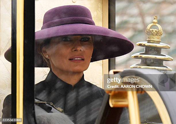 Britain's Queen Camilla and US First Lady Melania Trump travel in The Scottish State Coach during a horse-drawn procession towards Windsor Castle in...