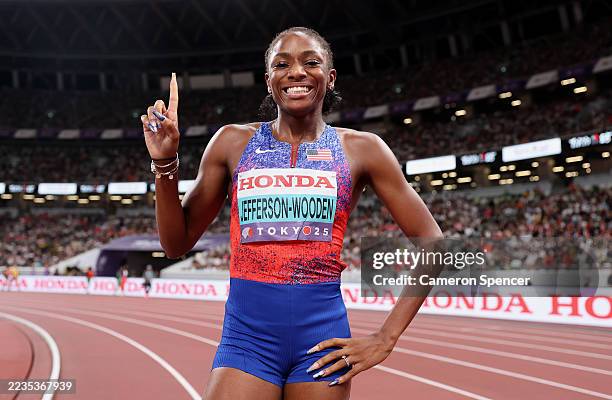 Gold medallist, Melissa Jefferson-Wooden of Team United States, celebrates poses for a photo after victory in the Women's 100 Metres Final on day two...